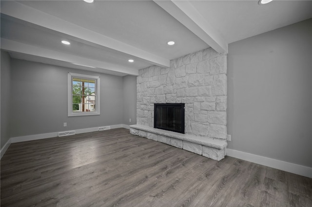 240 Wallingford Dr, Ross Twp, PA 15237 - unfurnished living room with beam ceiling, a stone fireplace, recessed lighting, and wood finished floors