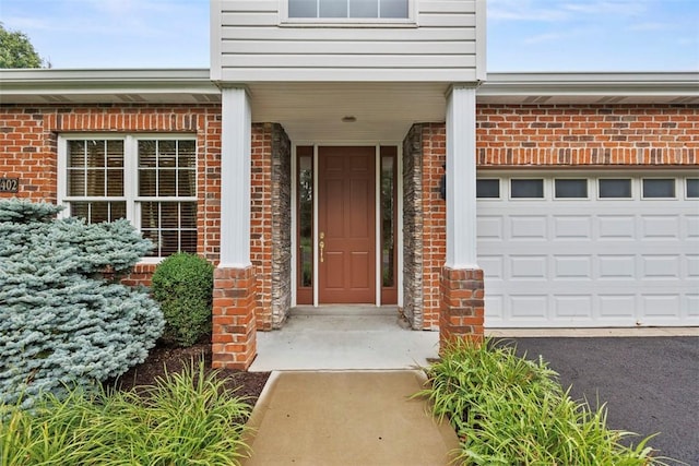 402 Providence Ct, Adams Twp, PA 16059 - entrance to property featuring brick siding, an attached garage, and asphalt driveway