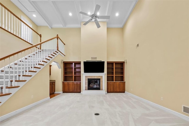 402 Providence Ct, Adams Twp, PA 16059 - unfurnished living room featuring a high ceiling, ceiling fan, carpet flooring, stairway, and a fireplace