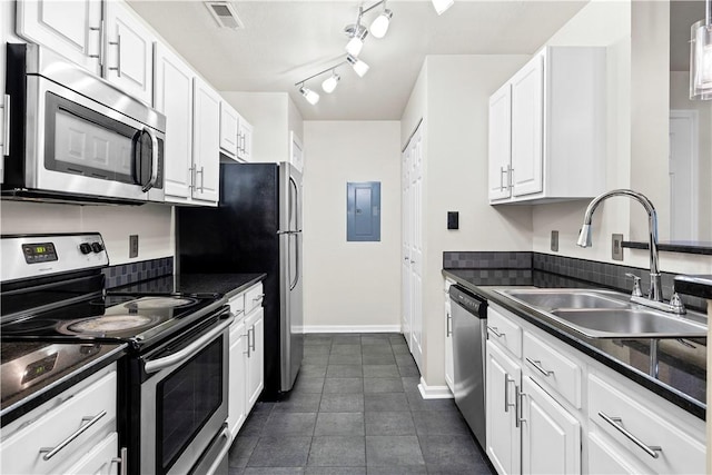 3011 Lenox Oval, Ross Twp, PA 15237 - kitchen with appliances with stainless steel finishes, electric panel, white cabinets, and dark countertops