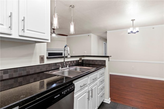 3011 Lenox Oval, Ross Twp, PA 15237 - kitchen featuring stainless steel dishwasher, white cabinetry, dark tile patterned floors, hanging light fixtures, and ornamental molding