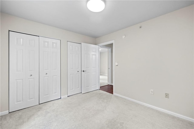 3011 Lenox Oval, Ross Twp, PA 15237 - unfurnished bedroom featuring two closets and carpet floors