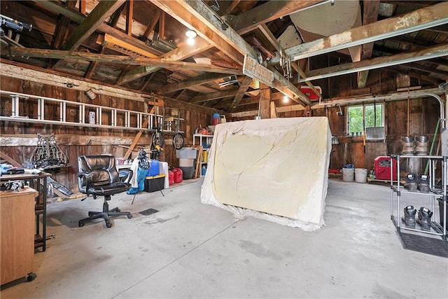 131 Heckman Rd, Delaware Twp, PA 16124 - misc room featuring wood walls and concrete floors