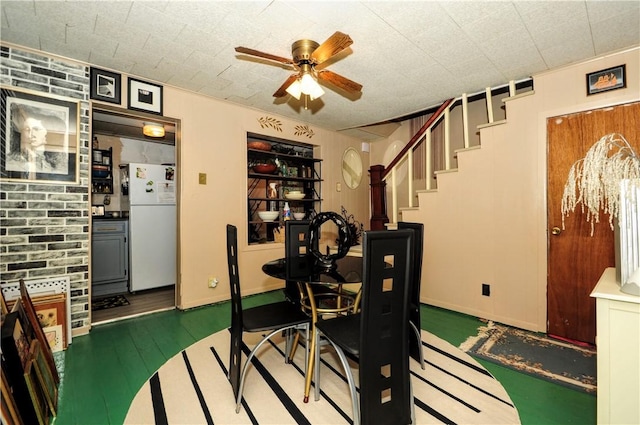 2 Mccormick Ave, Uniontown, PA 15401 - dining space with ceiling fan, wood finished floors, and stairs