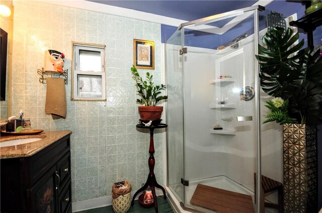 2 Mccormick Ave, Uniontown, PA 15401 - bathroom with vanity, tile walls, and a stall shower