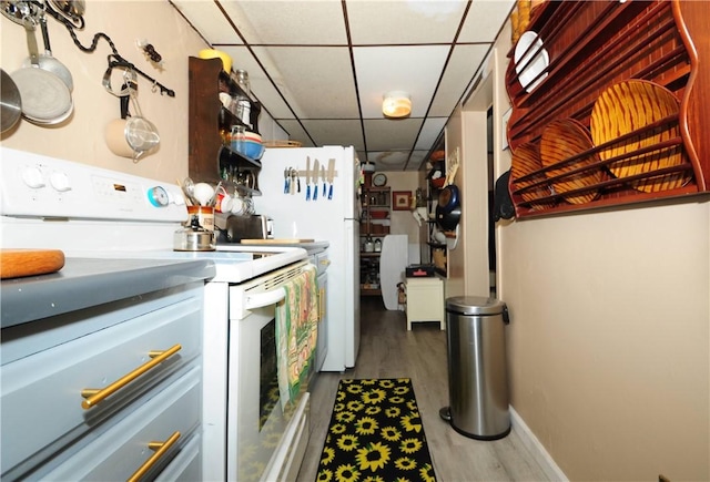 2 Mccormick Ave, Uniontown, PA 15401 - kitchen featuring a paneled ceiling, white range with electric cooktop, and wood finished floors