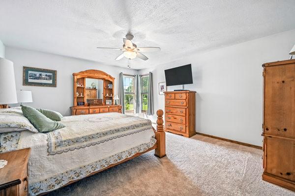 3129 Saranac Dr, South Pymatuning Twp, PA 16150 - carpeted bedroom with ceiling fan and a textured ceiling