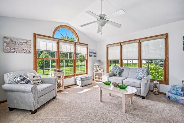 3129 Saranac Dr, South Pymatuning Twp, PA 16150 - living area with lofted ceiling, carpet, and a ceiling fan