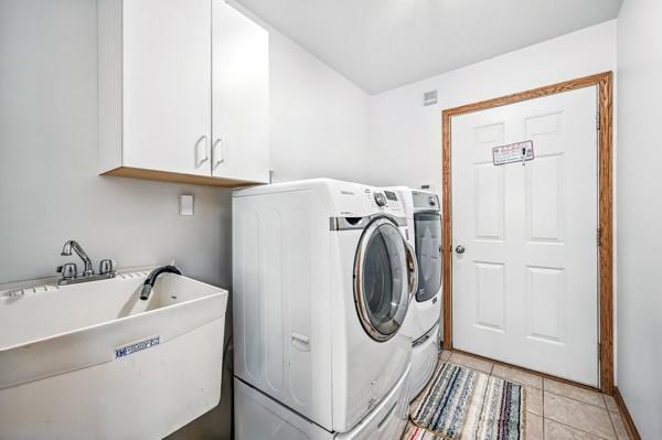 3129 Saranac Dr, South Pymatuning Twp, PA 16150 - laundry area with cabinet space, washing machine and clothes dryer, and light tile patterned floors