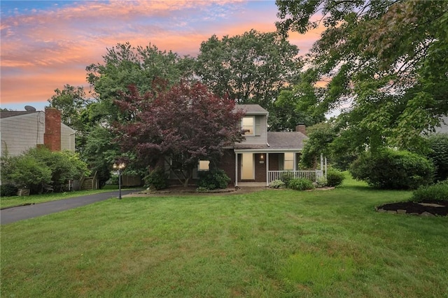 108 Colonial Dr, Leet Twp, PA 15143 - view of front of house featuring a porch, a front yard, and a chimney