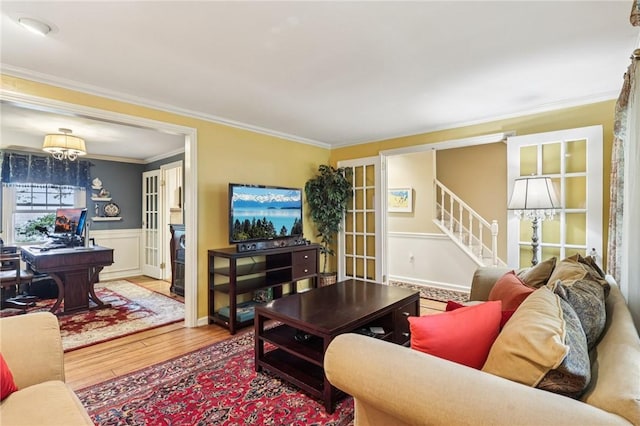 108 Colonial Dr, Leet Twp, PA 15143 - living room featuring wood finished floors, crown molding, stairs, french doors, and a wainscoted wall