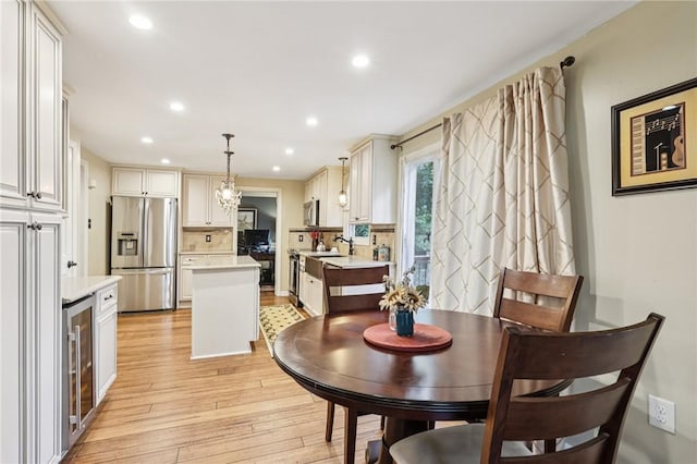 108 Colonial Dr, Leet Twp, PA 15143 - dining area featuring wine cooler, light wood-style flooring, and recessed lighting