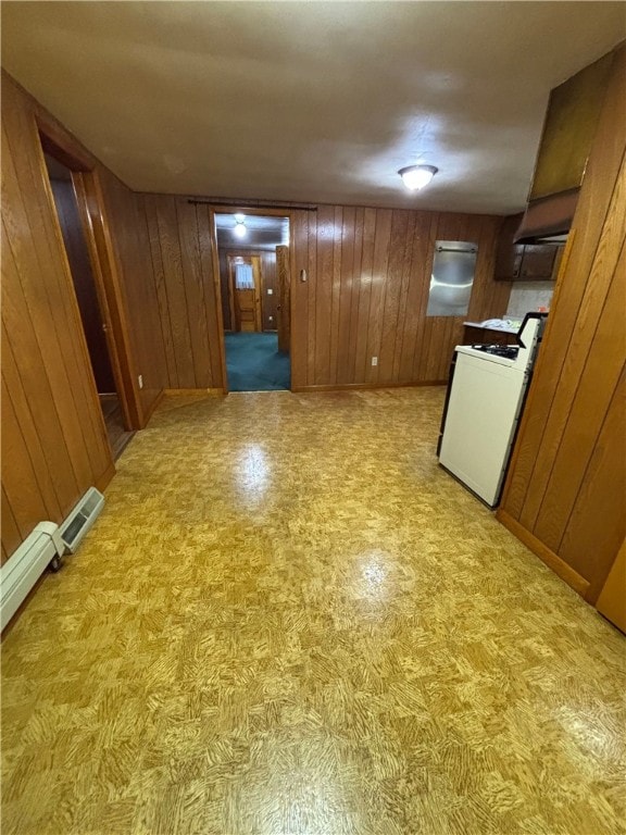184 Chestnut St, Center Twp/Homer Cty, PA 15731 - kitchen with stove, wood walls, brown cabinets, and light flooring