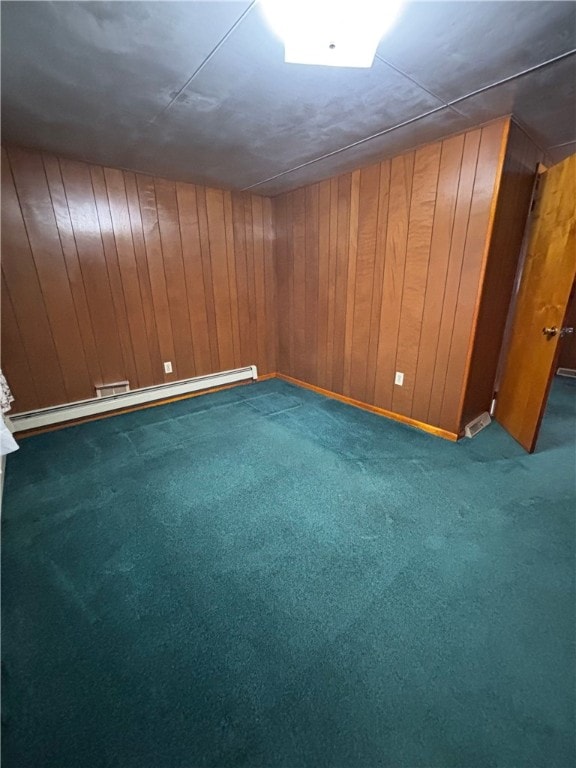 184 Chestnut St, Center Twp/Homer Cty, PA 15731 - below grade area featuring baseboard heating, carpet flooring, and wooden walls