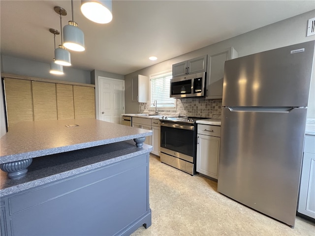 43 Barton Mill Rd, South Union Twp, PA 15401 - kitchen with stainless steel appliances, decorative backsplash, pendant lighting, and light countertops