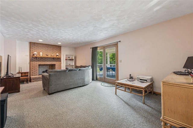 915 Jamell Dr, Unity Twp, PA 15601 - living area with a brick fireplace, a textured ceiling, carpet floors, and recessed lighting