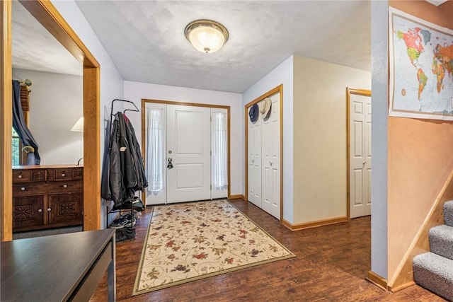 915 Jamell Dr, Unity Twp, PA 15601 - entryway featuring dark wood finished floors and stairs