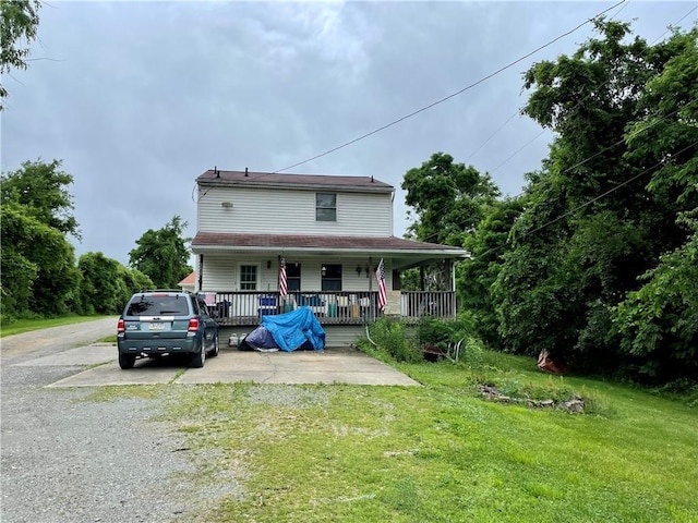 1027 Locust Ave, South Strabane, PA 15301 - view of front of property with covered porch, a front lawn, and driveway