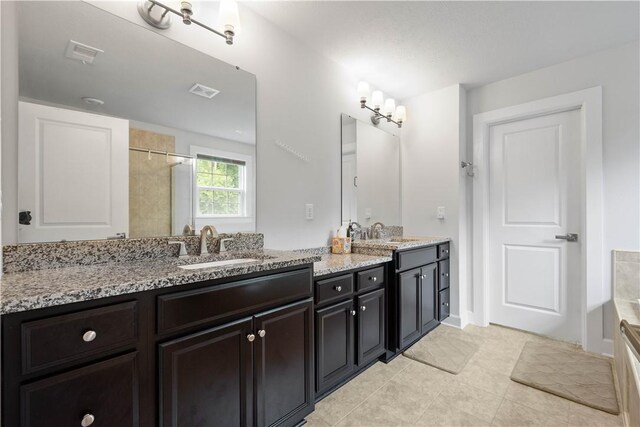 1761 Stevensan Dr, Franklin Park, PA 15143 - bathroom featuring double vanity, tile patterned flooring, and a shower
