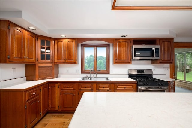 131 Windgate Dr, Marshall, PA 15090 - kitchen featuring stainless steel appliances, recessed lighting, light countertops, brown cabinets, and light wood-type flooring