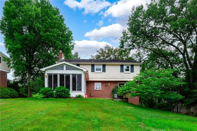 131 Windgate Dr, Marshall, PA 15090 - back of property featuring a chimney, brick siding, a lawn, and a sunroom