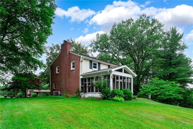 131 Windgate Dr, Marshall, PA 15090 - rear view of property featuring a sunroom, a chimney, a lawn, and brick siding