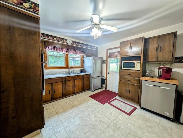 373 Pittsburgh St, Derry Twp, PA 15671 - kitchen with stainless steel appliances, plenty of natural light, a ceiling fan, and light countertops