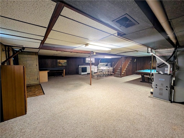 373 Pittsburgh St, Derry Twp, PA 15671 - finished basement featuring carpet, billiards, a paneled ceiling, heating unit, and wooden walls