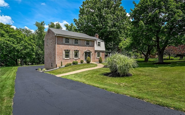 2276 Rochester Rd, Franklin Park, PA 15237 - view of front of house with brick siding, a front lawn, and a chimney