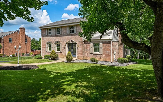 2276 Rochester Rd, Franklin Park, PA 15237 - colonial house with a front lawn and brick siding
