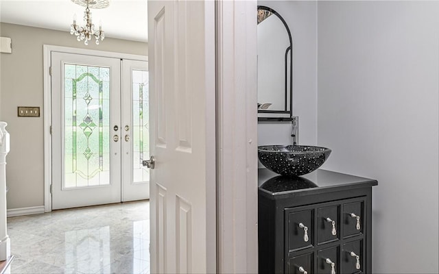 2276 Rochester Rd, Franklin Park, PA 15237 - entrance foyer featuring light marble finish flooring and a chandelier