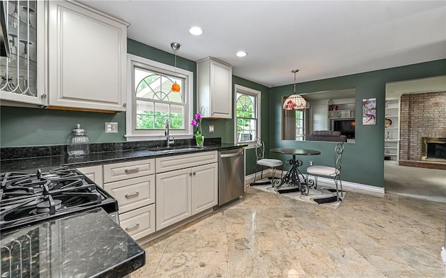 2276 Rochester Rd, Franklin Park, PA 15237 - kitchen with stainless steel dishwasher, open floor plan, pendant lighting, glass insert cabinets, and white cabinetry