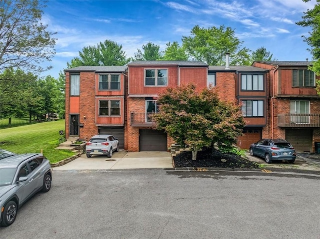 226 Glen Spring Cir, North Strabane, PA 15317 - view of front of home featuring a garage, driveway, brick siding, and a front lawn