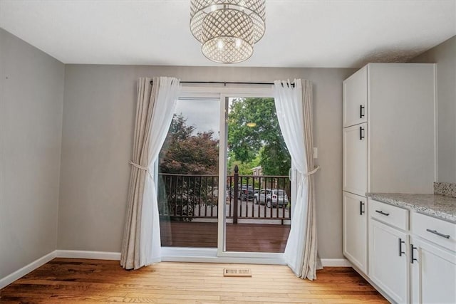 226 Glen Spring Cir, North Strabane, PA 15317 - doorway with a chandelier and light wood-type flooring