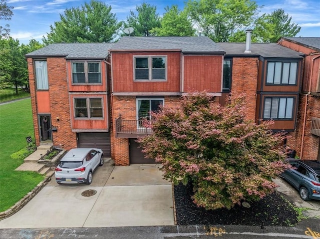 226 Glen Spring Cir, North Strabane, PA 15317 - townhome / multi-family property with an attached garage, driveway, brick siding, a shingled roof, and a front lawn