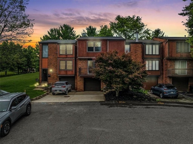 226 Glen Spring Cir, North Strabane, PA 15317 - multi unit property with an attached garage, driveway, brick siding, and a front yard