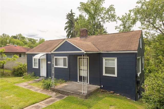 1048 Unity Center Rd, Plum Boro, PA 15239 - bungalow-style home with a front lawn, a chimney, a shingled roof, and entry steps