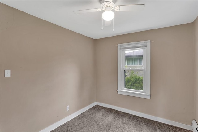 1048 Unity Center Rd, Plum Boro, PA 15239 - unfurnished room with dark colored carpet, ceiling fan, and a baseboard radiator
