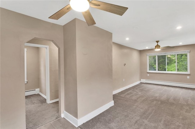 1048 Unity Center Rd, Plum Boro, PA 15239 - spare room with a baseboard heating unit, ceiling fan, carpet flooring, arched walkways, and recessed lighting