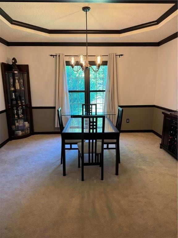 91 Celtic Ash Ct, Cranberry Twp, PA 16066 - dining area featuring ornamental molding, a tray ceiling, a chandelier, and light carpet