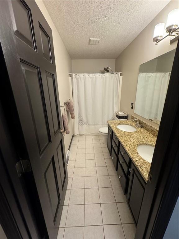 91 Celtic Ash Ct, Cranberry Twp, PA 16066 - bathroom with tile patterned flooring, double vanity, and a textured ceiling