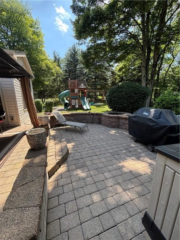 91 Celtic Ash Ct, Cranberry Twp, PA 16066 - view of patio featuring a playground and grilling area