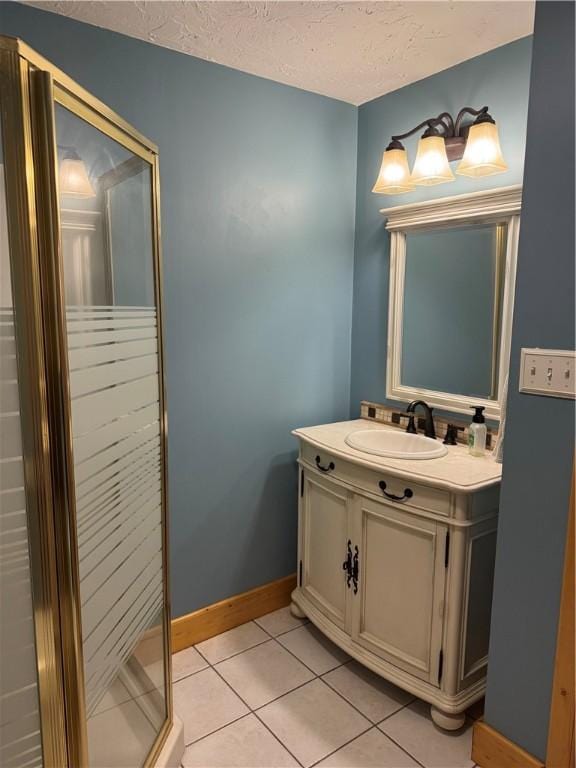 91 Celtic Ash Ct, Cranberry Twp, PA 16066 - bathroom featuring vanity, tile patterned flooring, a textured ceiling, and a shower stall