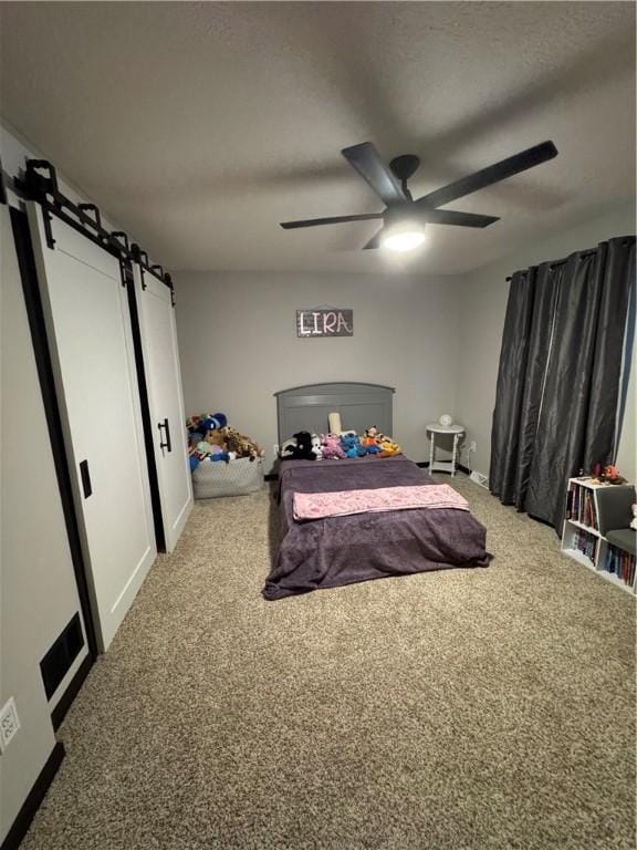 91 Celtic Ash Ct, Cranberry Twp, PA 16066 - carpeted bedroom featuring a barn door and ceiling fan