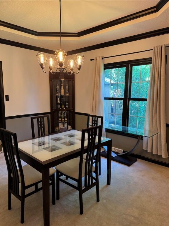 91 Celtic Ash Ct, Cranberry Twp, PA 16066 - dining area featuring ornamental molding, a chandelier, a raised ceiling, and carpet floors