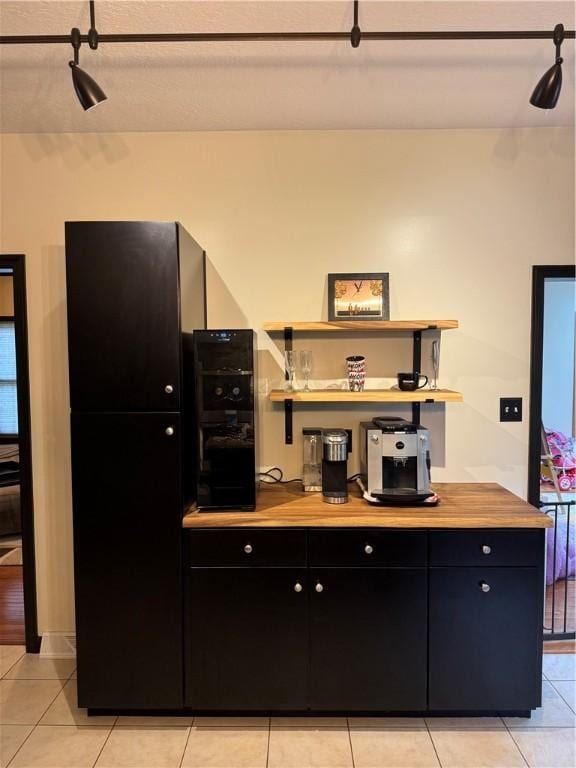 91 Celtic Ash Ct, Cranberry Twp, PA 16066 - kitchen featuring dark cabinetry, light tile patterned flooring, and open shelves