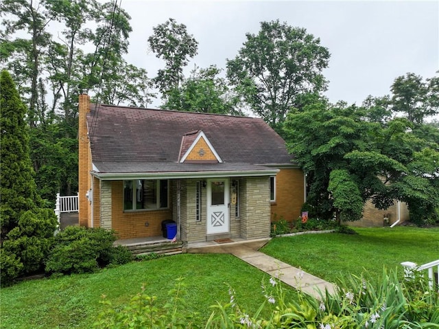 246 Maple Dr, Monroeville, PA 15146 - view of front of property featuring a front lawn, a chimney, covered porch, stone siding, and brick siding