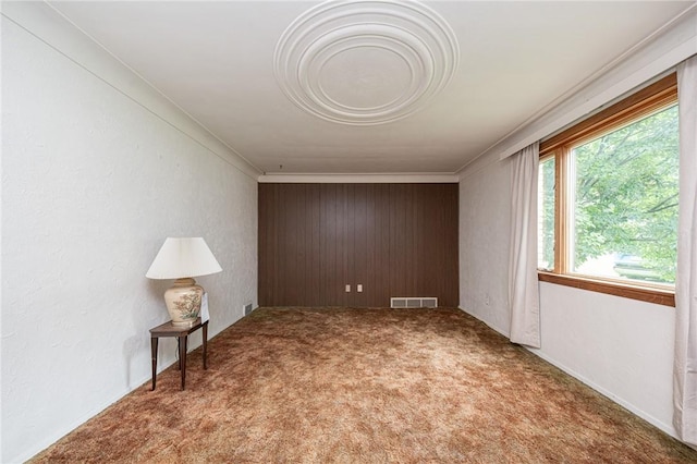 246 Maple Dr, Monroeville, PA 15146 - carpeted empty room featuring crown molding and wood walls