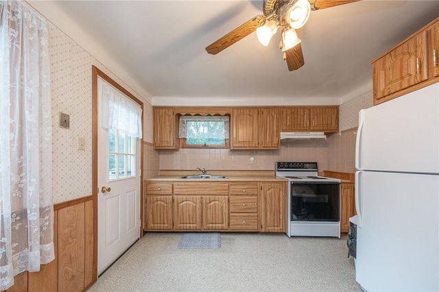 246 Maple Dr, Monroeville, PA 15146 - kitchen with white appliances, under cabinet range hood, light countertops, a ceiling fan, and wallpapered walls