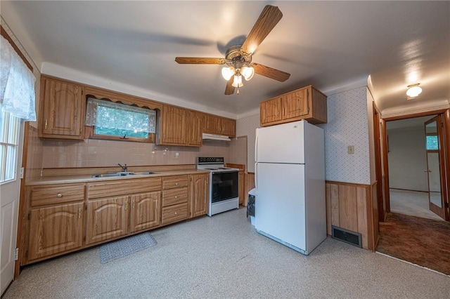 246 Maple Dr, Monroeville, PA 15146 - kitchen featuring white appliances, a wainscoted wall, under cabinet range hood, light countertops, and a ceiling fan